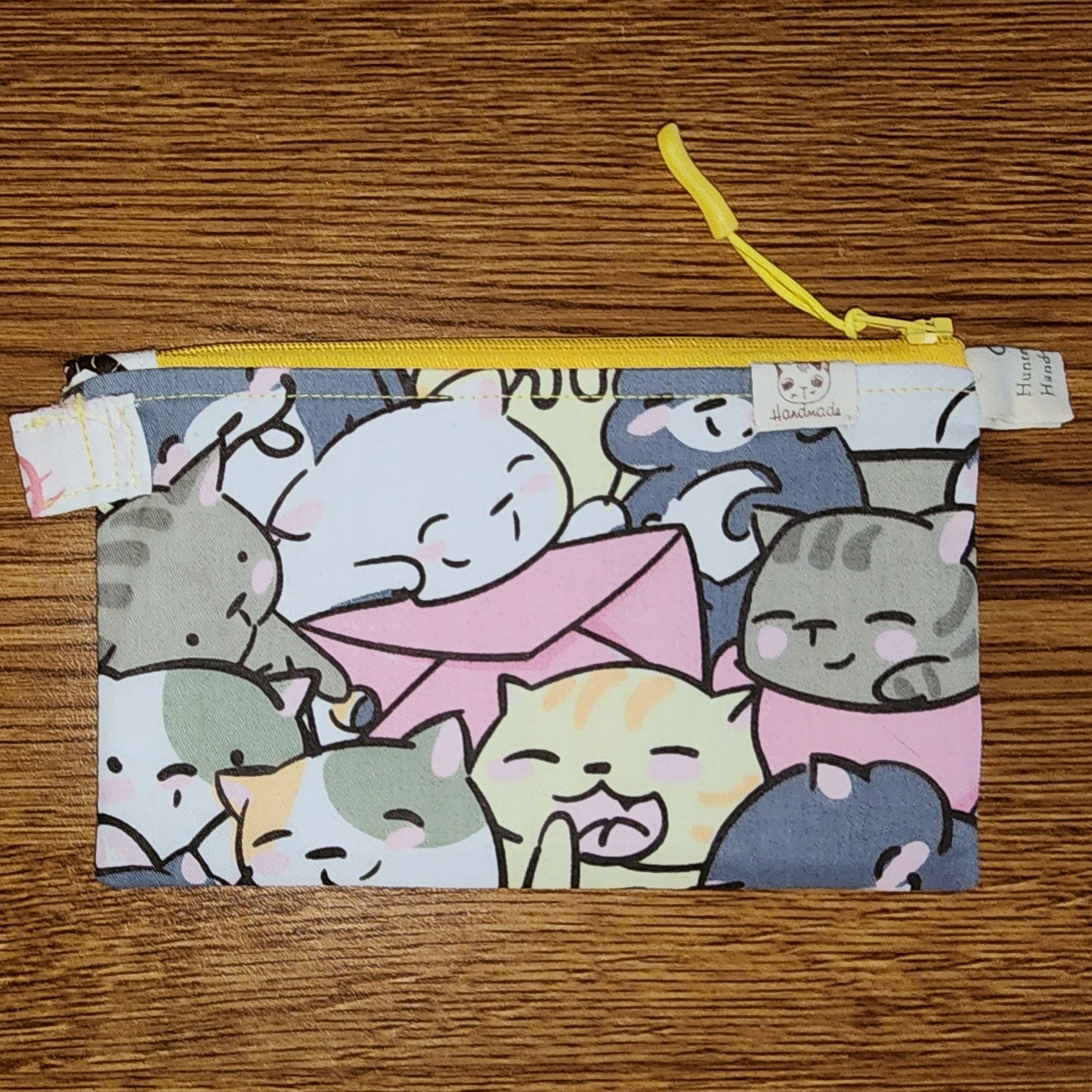 Cat pouch/purse: Medium Sized: Yellow Top Zipper: Great for ID, keys, coins/money, make-up, pencils/pens, and more. Approximately 5.5 High and about 8.5 wide