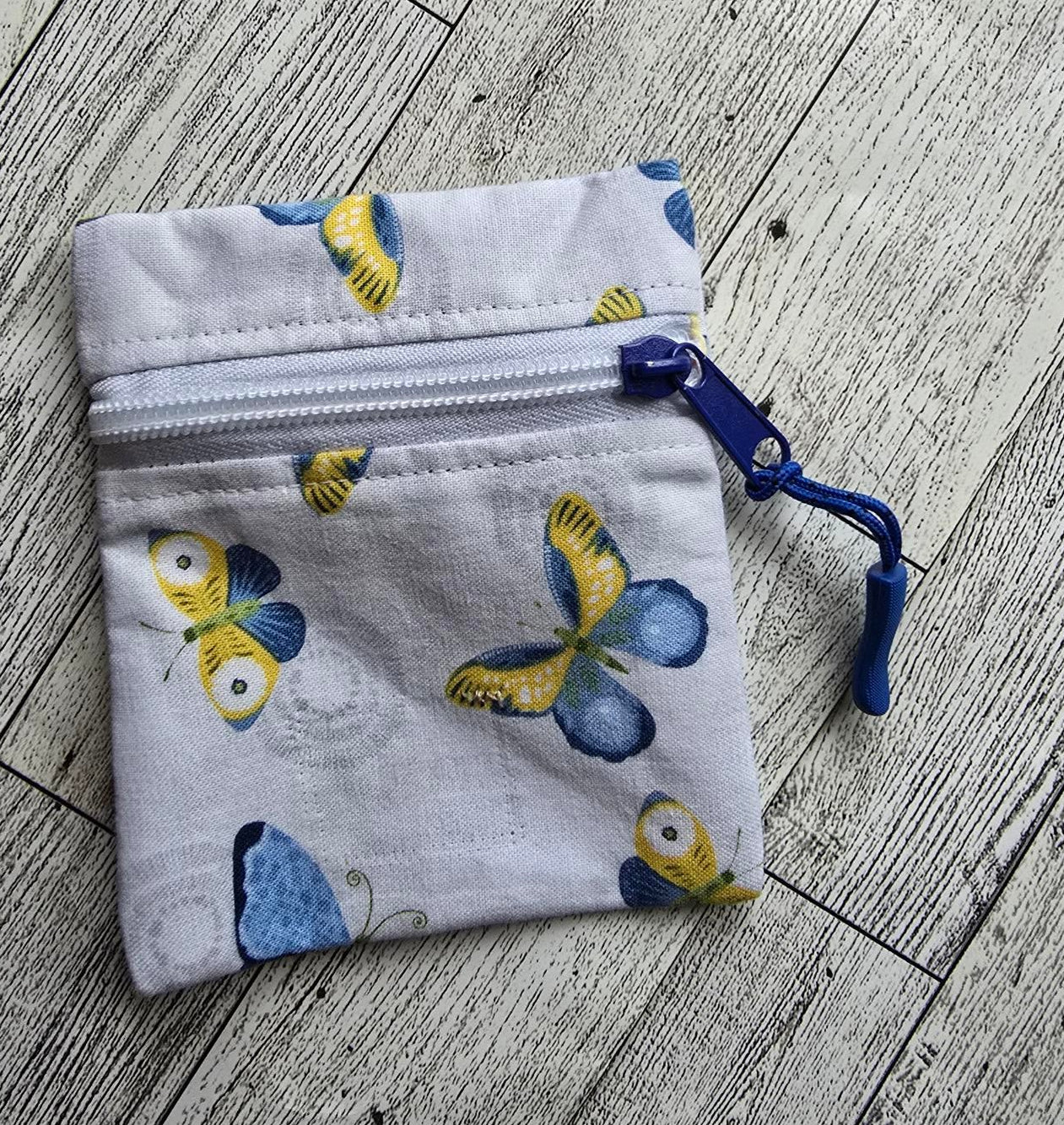 Small: White Front Zip : white with blue and yellow butterflies: great size for credit cards, coins, ear buds, folded money, ChapSticks : Great for tagging to keys