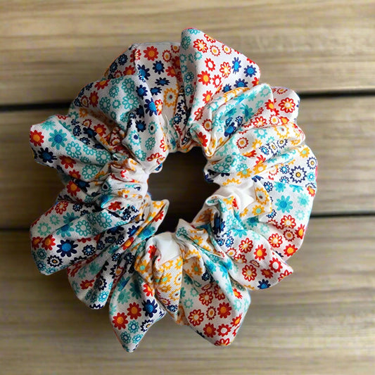 Scrunchies/ Ponytail Holder: two sided: multi-colored geographical floral pattern on front and white solid backing