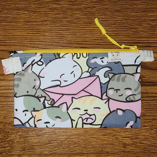 Cat pouch/purse: Medium Sized: Yellow Top Zipper: Great for ID, keys, coins/money, make-up, pencils/pens, and more. Approximately 5.5 High and about 8.5 wide 