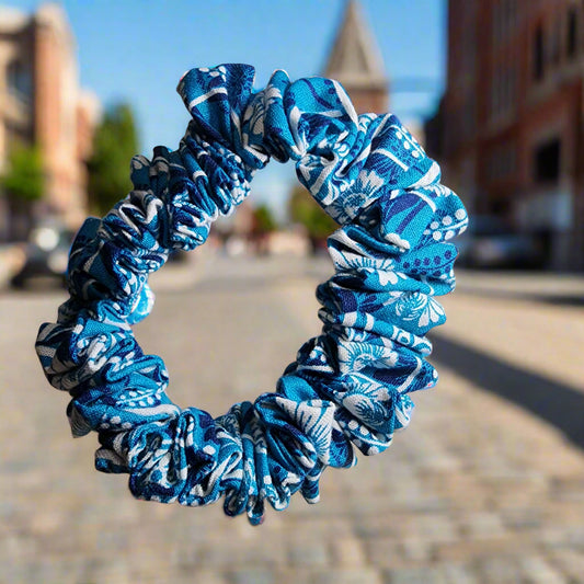 Teal scrunchie with white floral design. great for medium to thick hair