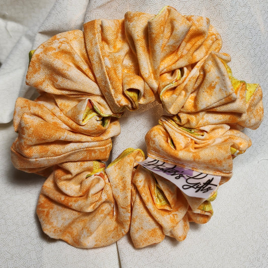 Two-sided multi-colored orange swirl/yellow patterned. hand-crafted, great for medium to thick hair. these will not break your hair. also great for fashionable wristlets' 